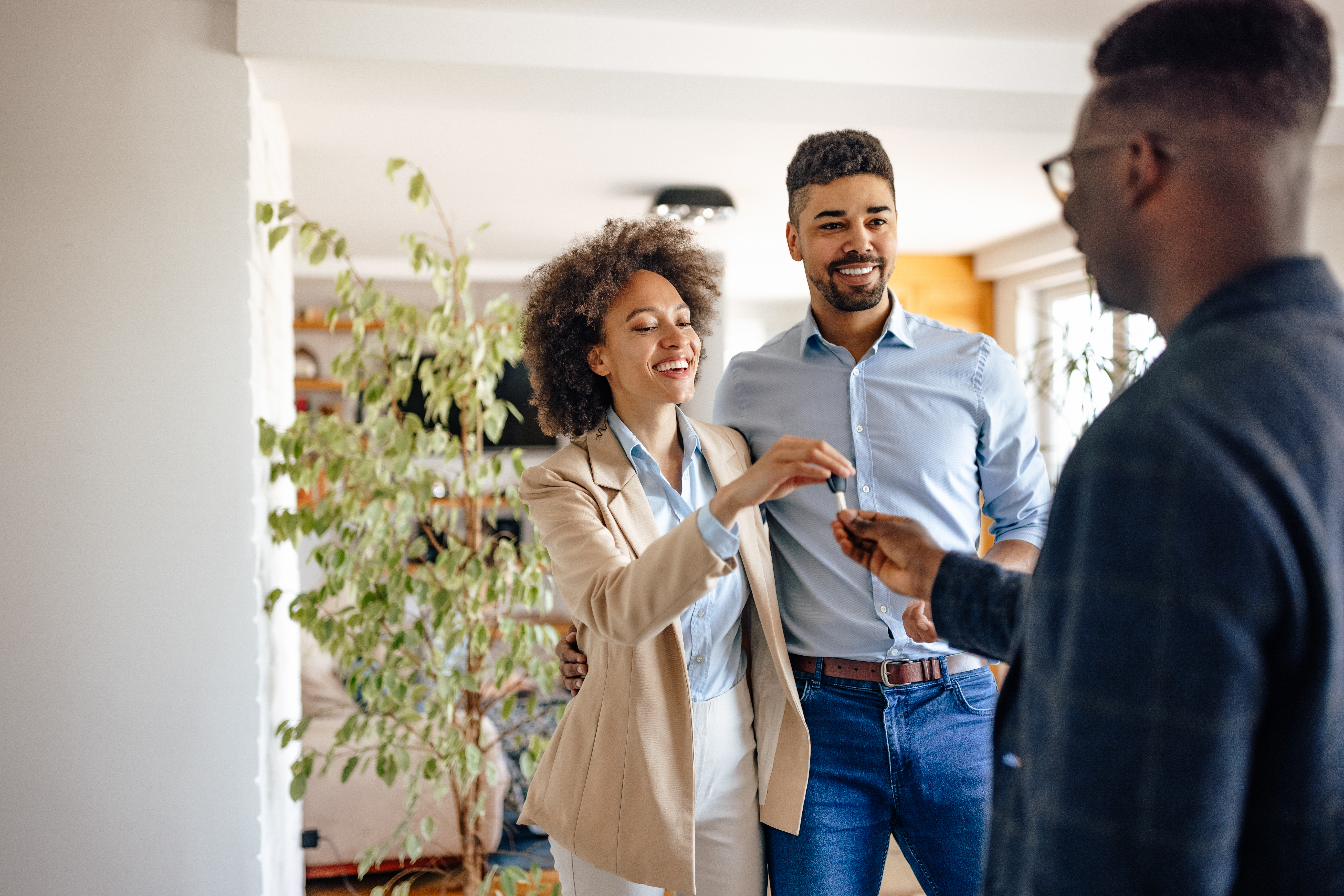 adult couple, buying a home, getting the key.