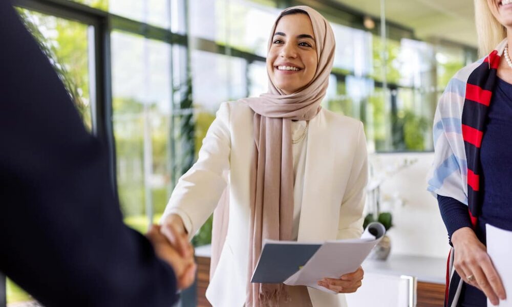property manager greeting a member of her team