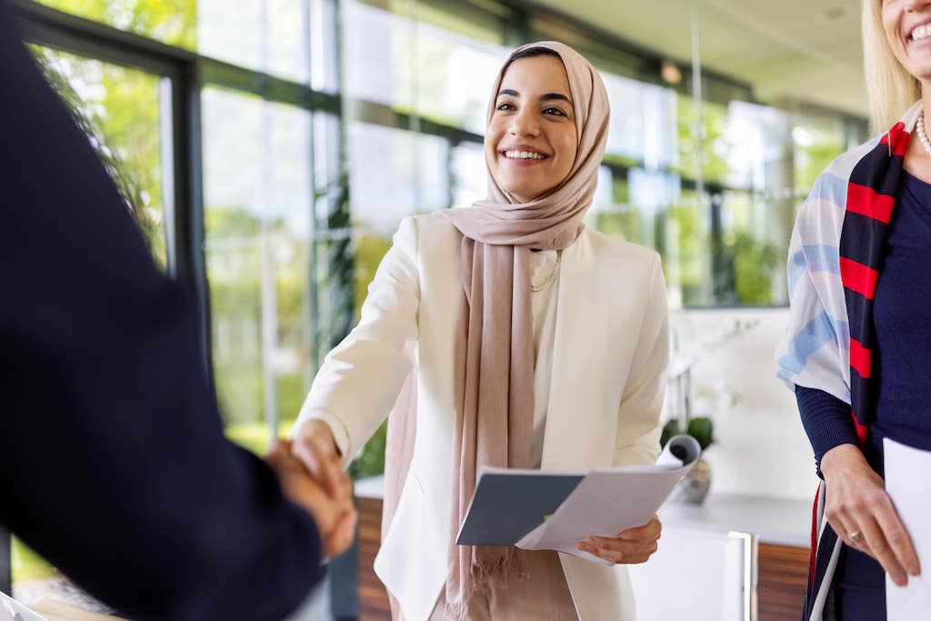 property manager greeting a member of her team