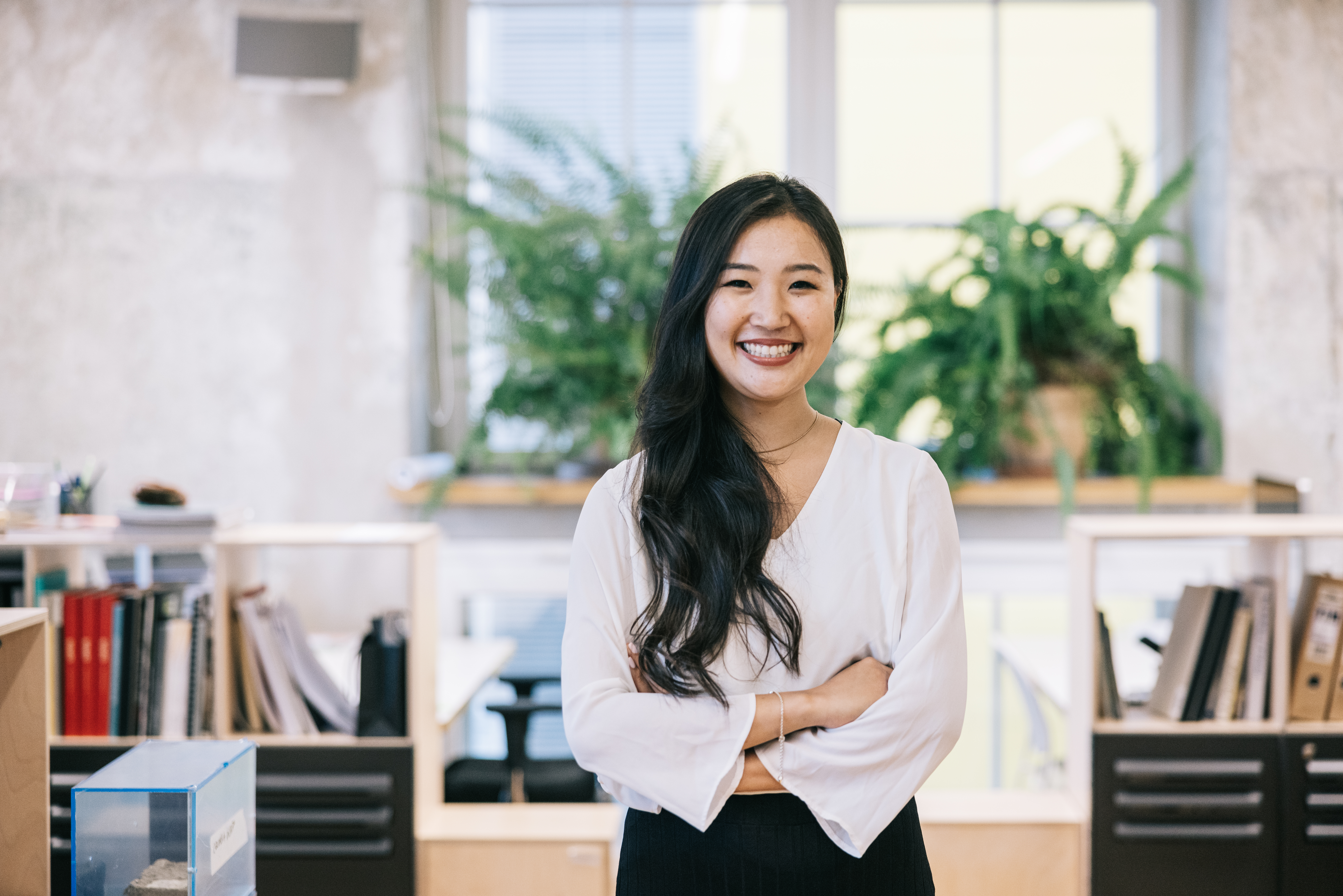 Portrait of confident real estate agent at modern office space.