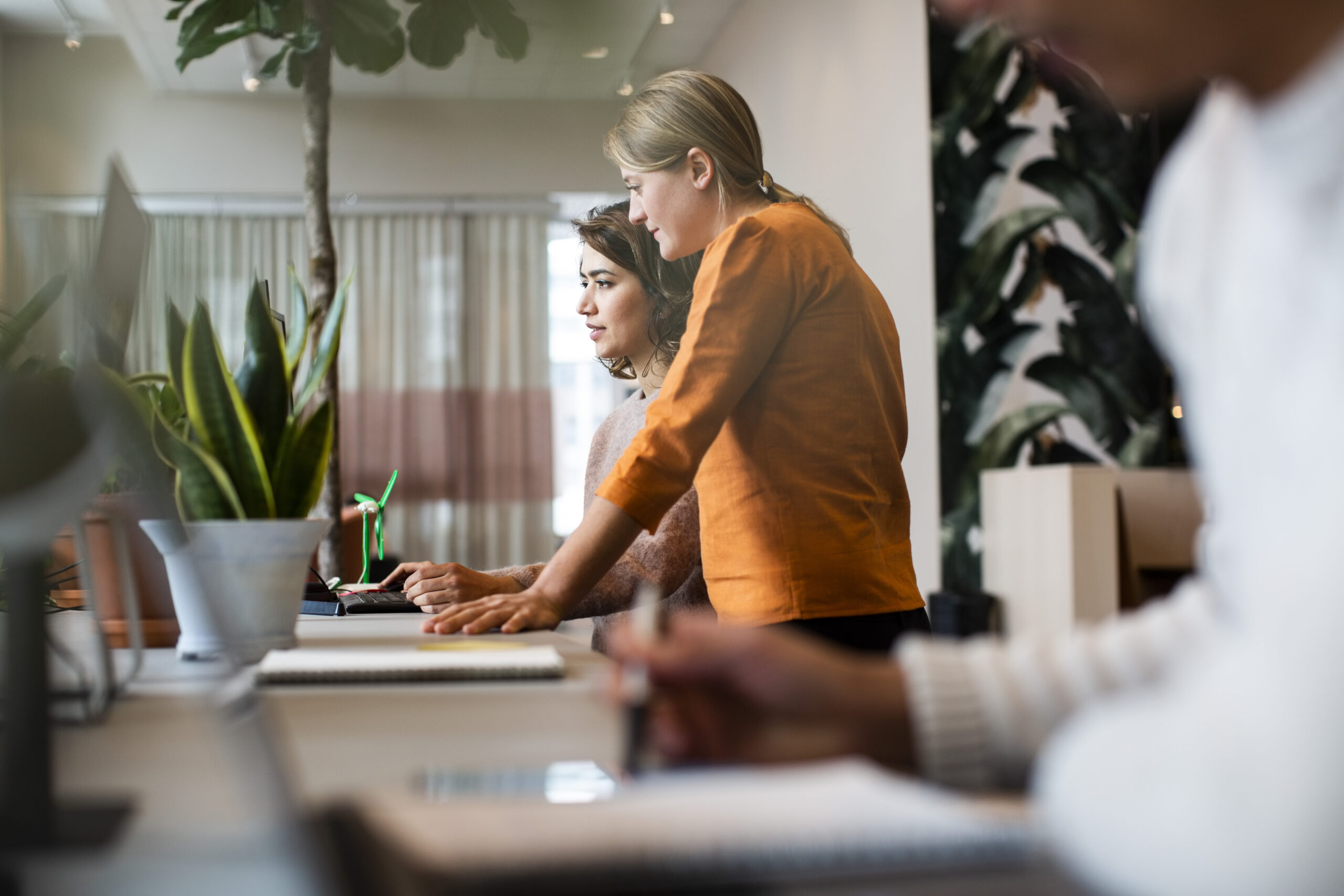 Two real estate agents working in an office setting
