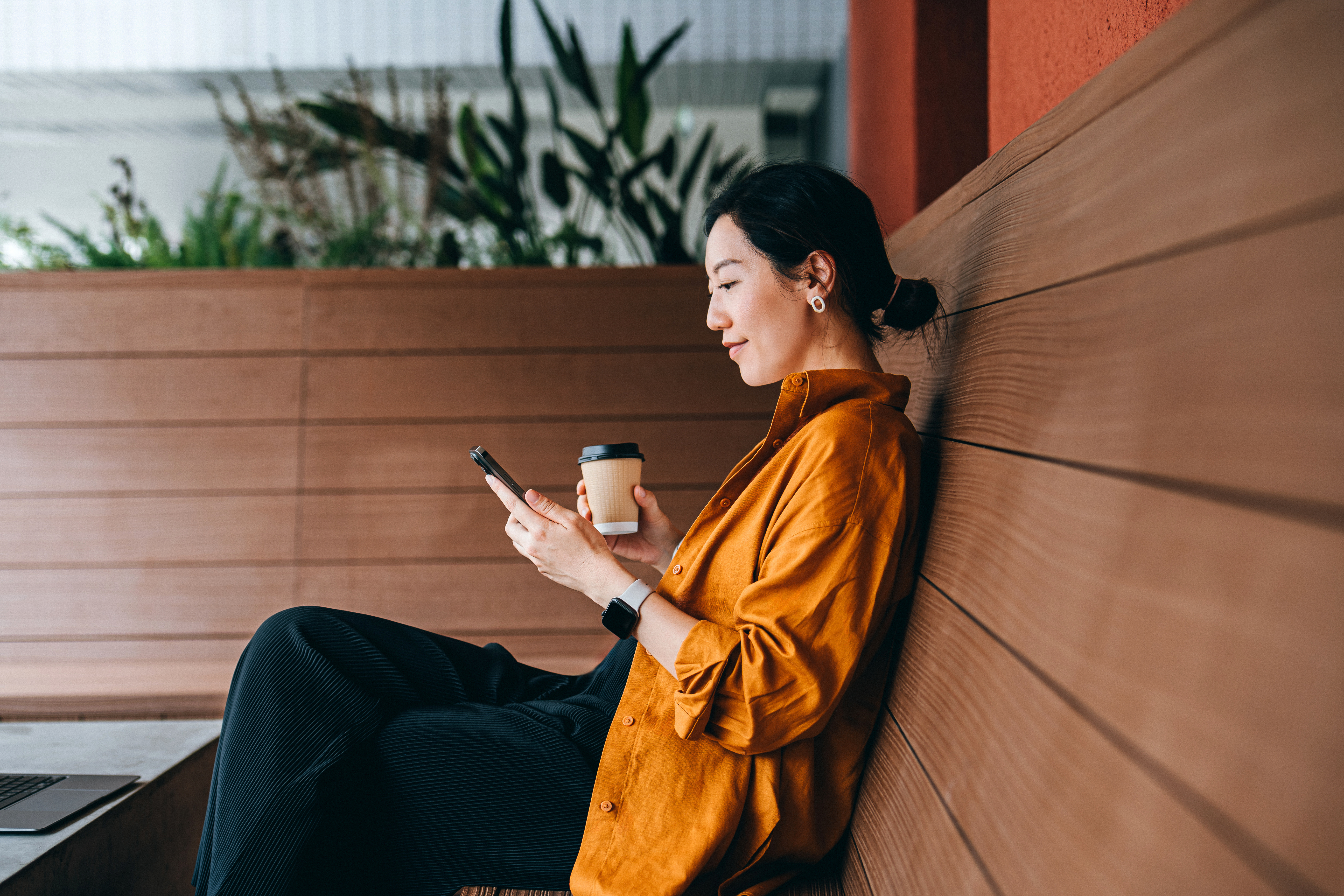 A female real estate agent working on her phone