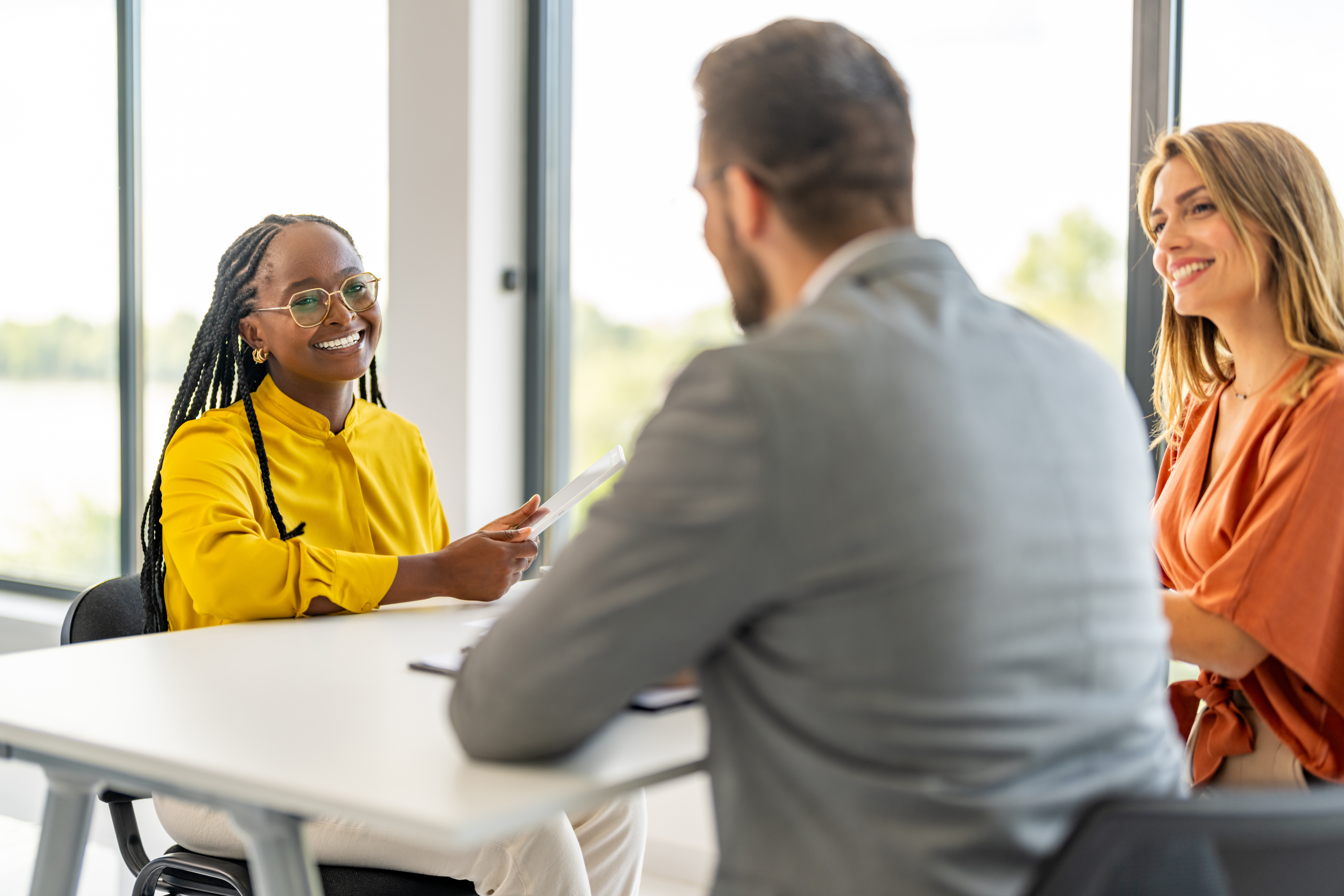 real estate agent talking to clients